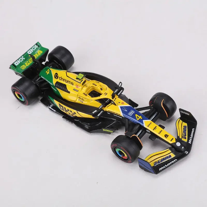 Bburago 1:43 McLaren Monaco Grand Prix diecast model featuring #4 Lando Norris and #81 Daniel Ricciardo, 2024 F1 collectible.